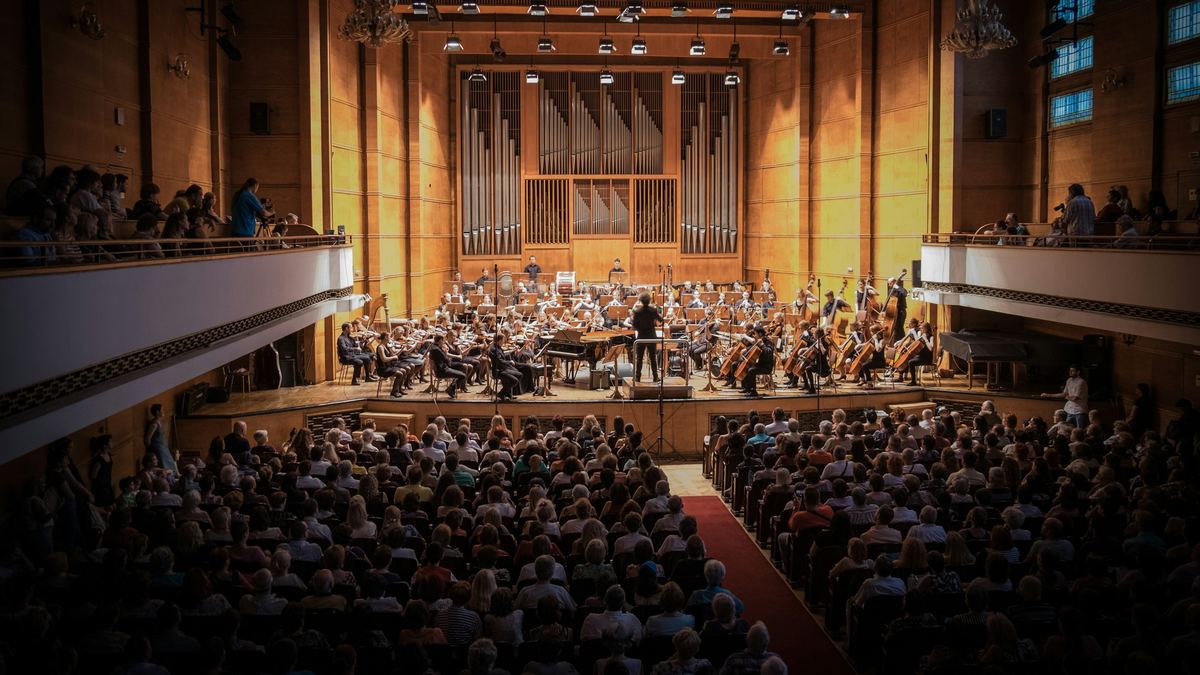 A full concert hall during an orchestral performance.