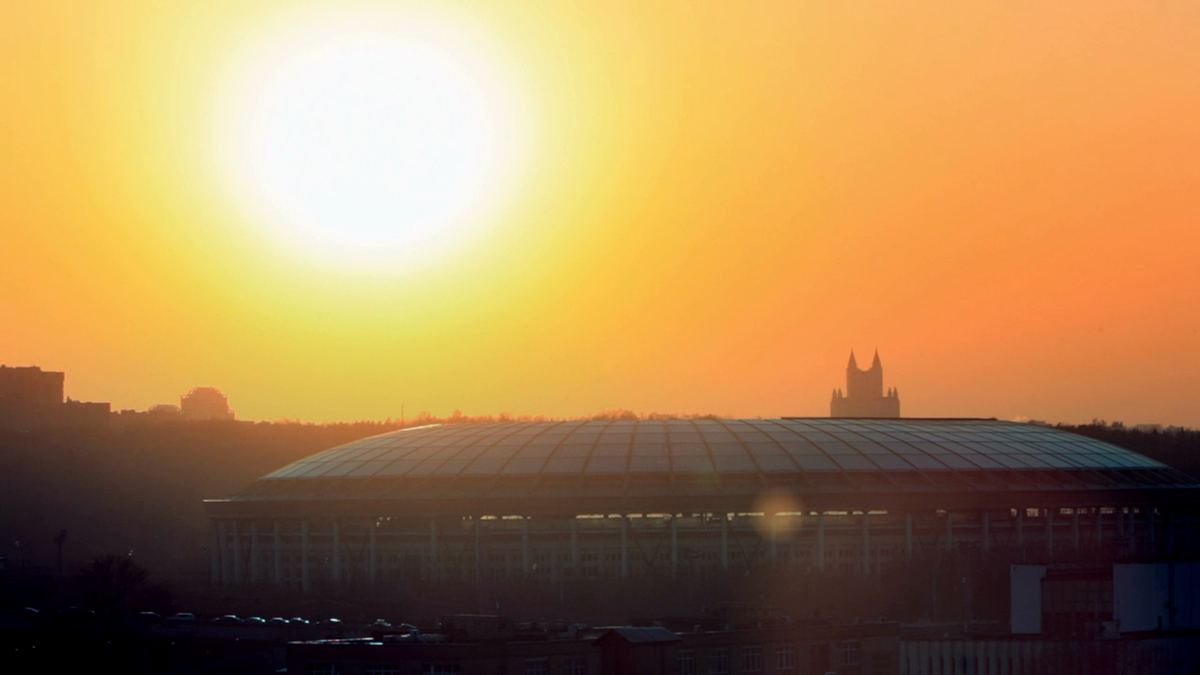 A stadium at sunset, before the crowd arrives.